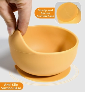 Detailed view of yellow silicone baby suction bowl showing strong table grip and flexibility