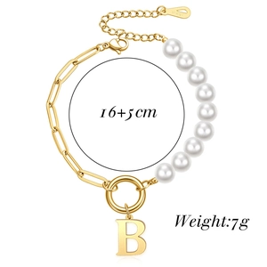 Detail of 18KGP gold paperclip and pearl bracelet with letter B pendant and logo tag