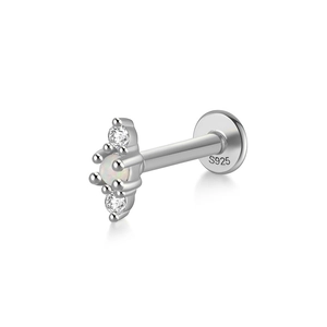 Macro detail of S925 silver labret earring with white opal and zircon stones