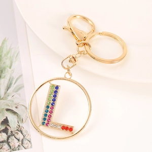Detail of golden letter L keychain with vibrant colorful rhinestones and lobster clasp