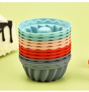 Close-up of stacked colorful silicone muffin molds showing wave edges and texture