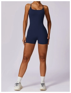 Front view of a dark blue athletic one-piece romper with thin straps and U-neckline