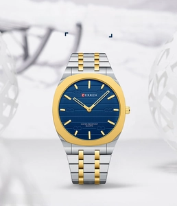 Macro detail of Curren slim waterproof watch with blue textured dial and gold accents