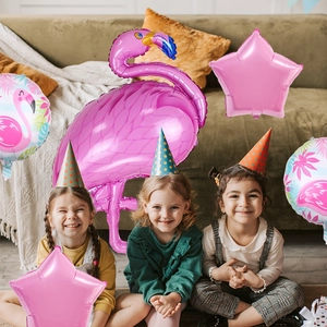 Tropical Flamingo balloon set decorations featuring giant pink foil stars and palm leaf theme