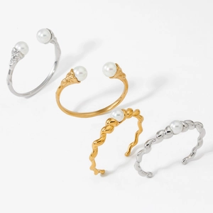 Adjustable stainless steel pearl open bangles in gold and silver with twisted designs