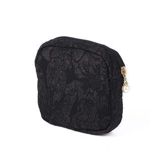 Mini black jacquard canvas pouch with 3D floral pattern and elegant pearl zipper charm