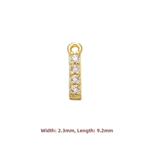 Close-up of small gold plated S925 silver rectangle pendant with micro paved zircon stones