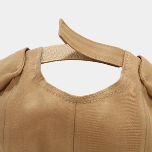 Detail of adjustable Velcro strap on a khaki cotton twill brimless docker cap