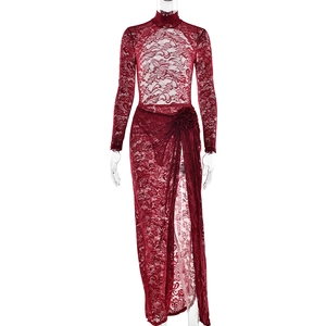Detail of red lace dress showing high neck sheer top and floral waist embellishment