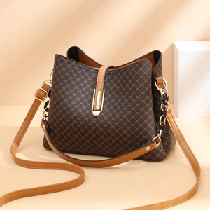 Brown geometric patterned PU leather bucket handbag with gold metal clasp and shoulder strap