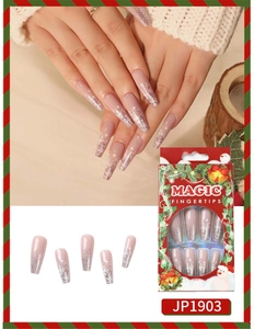 Detail of pink gradient press-on nails with white snowflakes and Christmas packaging
