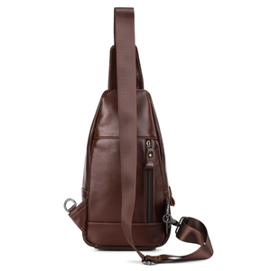 Detailed view of genuine leather texture and premium metal zipper on brown chest bag