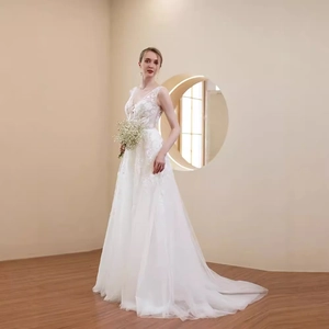 Elegant white V-neck lace wedding dress with a long tulle train and floral embroidery