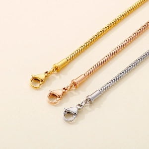 Minimalist stainless steel snake bone bracelets in gold, rose gold, and silver finishes