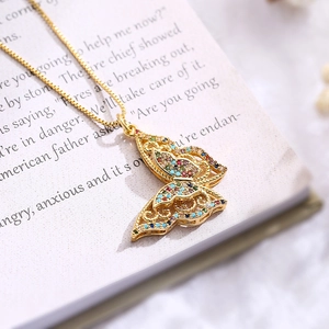 Gold-plated butterfly tree of life pendant necklace with multicolor zircons on book