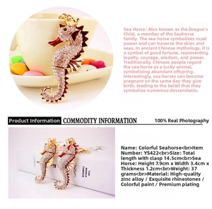 Detailed view of seahorse keychain with red rhinestones and golden zinc alloy base
