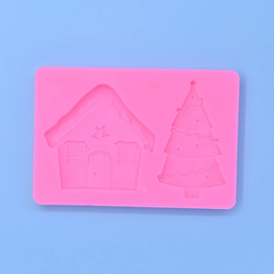 Pink silicone mold featuring Christmas gingerbread house and star tree for DIY cake baking