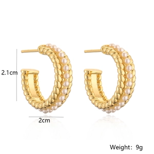 Golden C-shaped pearl earrings with 2.1cm dimensions and 9g weight on white background