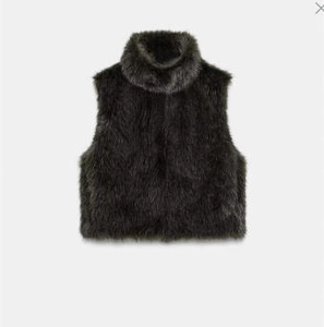Detailed view of black faux fur high-neck vest with a soft textured finish