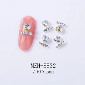 Macro shot of 7.5mm heart-shaped silver nail gems with rhinestones for nail art