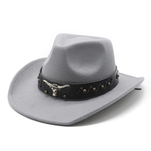 Detail of grey wool cowboy hat with leather band and silver bull head metal emblem