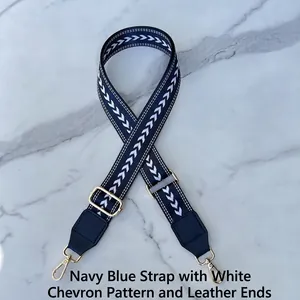 Adjustable wide replacement strap with white arrow pattern on dark blue webbing and gold clips