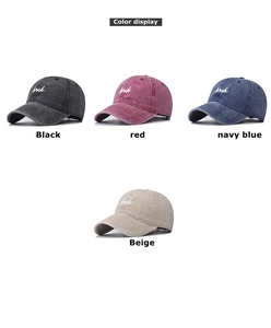 Detail view of washed cotton baseball caps with bruh embroidery in four colors