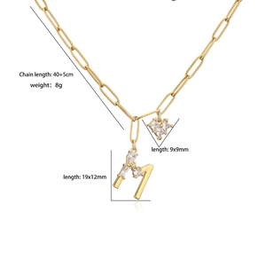 Gold paperclip chain necklace featuring cubic zirconia heart and letter M pendants
