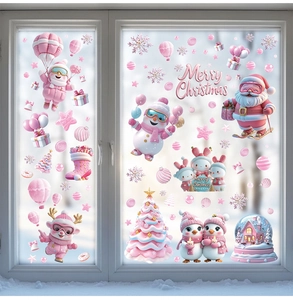 Macro view of pink 3D cartoon Christmas window stickers with Santa and reindeer