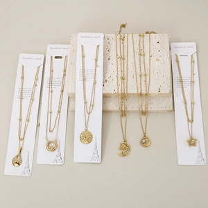 Collection of 18K gold-plated stainless steel necklaces with celestial and geometric charms