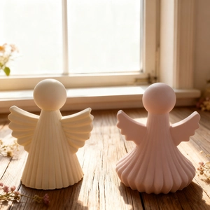 Detail of angel wing aromatherapy plaster figurines with fine vertical stripe textures