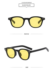 Detail view of oval retro sunglasses with black frames and yellow lenses in two angles