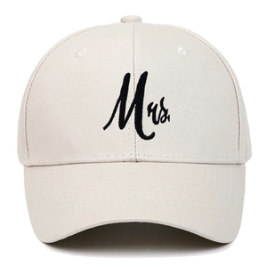 Close-up of beige cotton baseball cap featuring black Mrs. embroidery on front