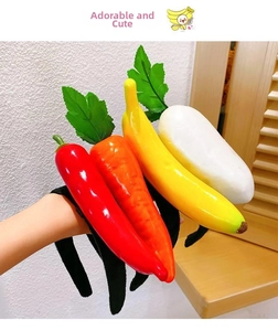 Close-up of colorful plush vegetable headbands featuring pepper and carrot designs