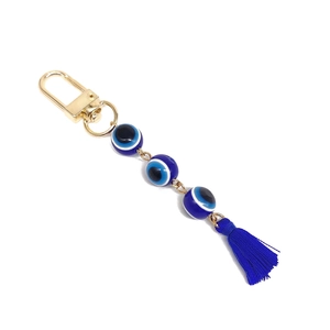 Evil eye keychain with blue beads and tassel in gold plating for car or bag