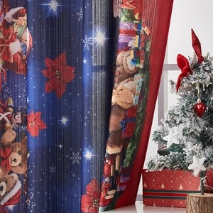 Detail of Christmas curtain featuring Santa and bears on navy blue printed fabric