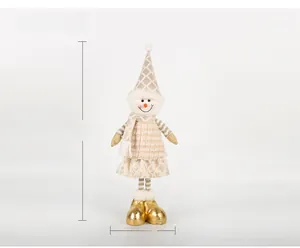 Detailed view of champagne gold Santa doll with sequined skirt and golden boots, 56cm tall