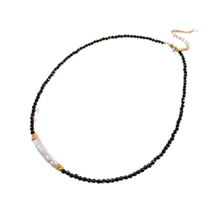 Elegant beaded necklace with faceted black crystals and a baroque pearl pendant center