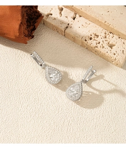 Detail shot of S925 sterling silver pear-cut drop earrings with micro-pave setting