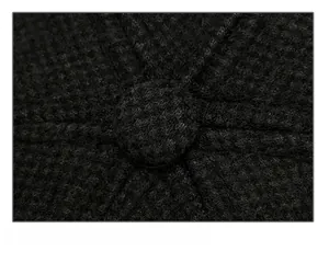 Detail of reinforced crown stitching and knit texture on this black winter baseball cap