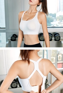 Close-up of white sports bra featuring back four-row buckle and racerback detail