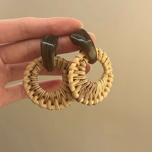 Bohemian style rattan drop earrings with dark brown resin tops and woven round hoops