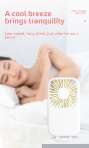 Silent white portable desktop fan with seven yellow blades showing a quiet sleeping scene