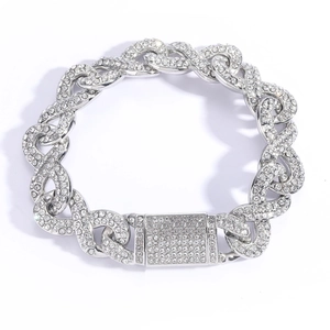 Silver iced out Cuban link necklace with rhinestone infinity buckle on white background