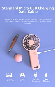 Pink portable handheld mini fan with Micro USB charging cable and quiet motor design