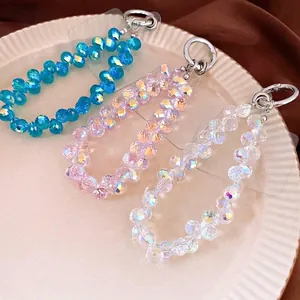 Luxe crystal bead phone charms in blue, pink, and white with faceted sparkle finish