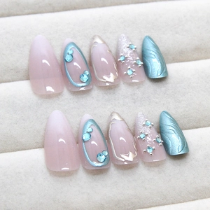 Pink and blue gradient press-on nails with silver glitter and rhinestone accents