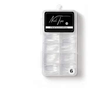 Macro shot of 100 transparent coffin nail tips in a numbered plastic storage box