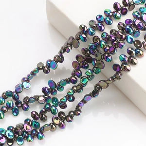 Detailed view of iridescent moon crescent crystal beads for DIY jewelry making