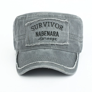 Detailed top view of grey washed canvas cadet cap with vintage frayed patches and embroidery